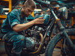 © pavlofox - Mechanic Examining Vintage Motorcycle Engine In Workshop