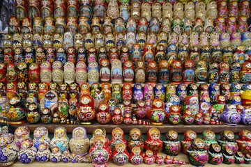 Moscow, Russia - February 5, 2016: Interior of various beautiful matryoshka dolls for sale on the shelf in a souvenir shop
