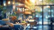 © JovialFox - A blurred view of a cozy cafe interior with warm lighting and an inviting atmosphere, showcasing a variety of fresh food items arranged on a wooden counter.