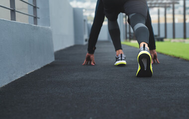 Canvas Print - Start, runner and person with fitness, shoes and workout with race, sportswear and endurance. Closeup, legs and athlete with sneaker, beginning marathon and cardio with challenge, balance or exercise