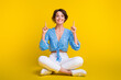 © deagreez - Full length photo of funky overjoyed girl dressed print blouse sit indicating at discount empty space isolated on yellow color background
