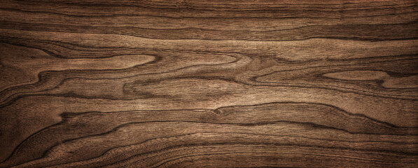 Wall Mural - Walnut tree texture close up. Wide walnut wood texture background. Walnut veneer is used in luxury finishes.