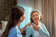 © CandyRetriever  - Asian woman doctor examine and consult senior patient on the bed in bedroom. Private duty nurse take care elderly woman suffering from shoulder pain at home. Home medical caregiving service concept.
