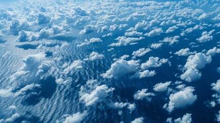 Poster - Aerial view of cirrocumulus clouds forming a delicate pattern of ripples across a deep blue sky.