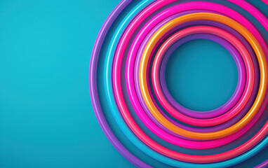 Poster - Colorful circular rings on a turquoise background creating a dynamic and vibrant abstract pattern. Perfect for modern designs and creative projects.