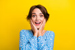 © deagreez - Photo of pretty impressed woman wear flower print blouse arms cheeks open mouth isolated yellow color background