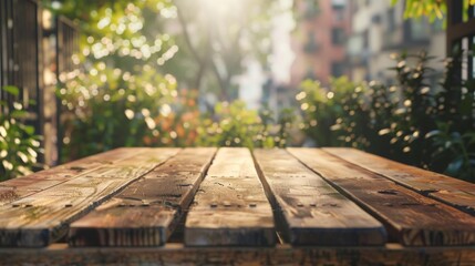 Poster - A wooden table sits in a sunny garden, with green foliage and a blurred city backdrop.