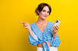 © deagreez - Photo of good mood funny woman wear flower print blouse texting modern device pointing empty space isolated yellow color background