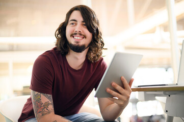 Poster - Business, man and thinking with tablet in office for research ideas, problem solving and proposal solution. Designer, intern and happy with technology for digital design inspiration and planning