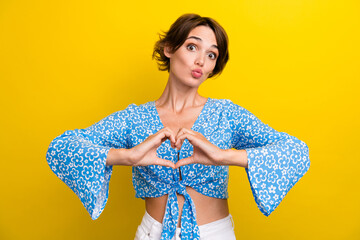 Sticker - Photo of dreamy shiny young woman wear flower print blouse sending kiss showing arms heart isolated yellow color background