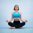 © InfiniteFlow - Full body length gaiety shot athletic and sporty woman doing healthy and meditative yoga exercise workout posture on isolated background. Healthy active and body care lifestyle