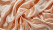 © Napasnan - Pale peach beige silk satin fabric with delicate folds and soft drapery.