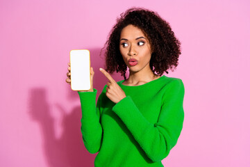 Sticker - Photo portrait of lovely young lady show point amazed white screen dressed stylish green garment isolated on pink color background