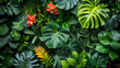 © pimnada - An array of exotic tropical plants with rich green foliage