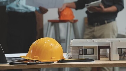 Wall Mural - Teamwork men in construction site, Two civil engineer or professional foreman in safety helmet hard hat using blueprint in digital tablet working while standing at industrial factory, teamwork concept