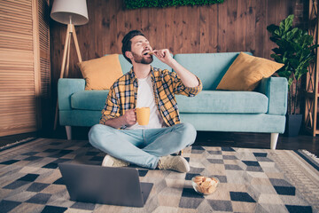 Canvas Print - Photo of funky cool guy dressed checkered shirt watching movie modern device enjoy cookies indoors house apartment room