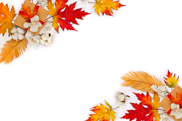Wall Mural - autumnal maple leaves, golden yellow leaves palm tree, cotton flowers, gift box on white background 