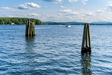 Photograph of two wooden pylons in the ocean 