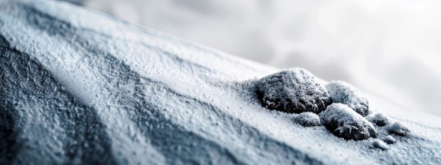 Sticker -  A tight shot of a snow-covered hill with a protruding dog paw from the snowy surface