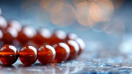 Poster -  A red marble row rests atop a blue countertop against a softly blurred backdrop