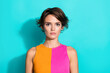© deagreez - Photo of serious confident lady dressed colorful top looking you empty space isolated turquoise color background
