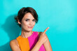 © deagreez - Photo of pretty sweet woman wear pink orange top showing finger empty space isolated teal color background