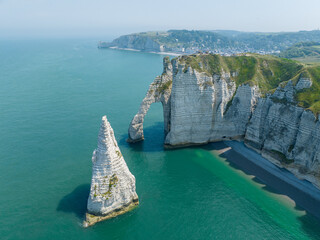 Wall Mural - Aerial view of Etretat cliffs and the Atlantic ocean. Chalk cliffs and three natural arches. Panoramic path to admire the coast. Normandy region of Northwestern France. 06-26-2024