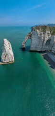 Wall Mural - Aerial view of Etretat cliffs and the Atlantic ocean. Chalk cliffs and three natural arches. Panoramic path to admire the coast. Normandy region of Northwestern France. 06-26-2024