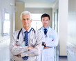 © Beak/peopleimages.com - Portrait, doctor and mature man with arms crossed, serious and leadership in hospital, proud and expert. Clinic, medical professional and confidence of people, healthcare and services for employee