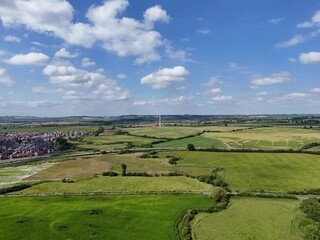 Wall Mural - Aerial view of the green fields in the countryside of Berryfields, Aylesbury, England on a sunny day