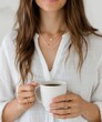 © homeganko - Woman Holding a White Mug