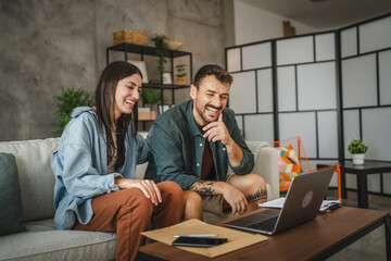 Wall Mural - couple work from home on laptop and have video call consultation