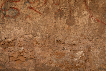 Poster - A weathered brick wall with remnants of red paint
