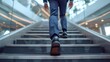© Sergey - Close-up of a young businessman's feet sprinting up a modern staircase, showcasing determination and upward movement within a corporate environment.