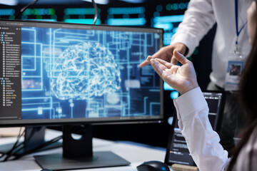 Wall Mural - Technicians working in data center with artificial intelligence technology to process massive datasets, close up. IT specialists in server hub facility storing data used for machine learning