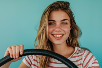 Poster - A happy woman holds the steering wheel and smiles, suggesting a sense of control or satisfaction