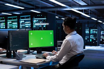 Poster - admin in data center using diagnostic tools and system monitoring software on green screen pc to ide