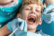 © Виктория Марьенко - A dentist examines a child's teeth in a chair, focusing on dental health and hygiene