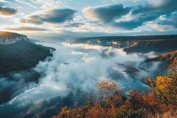 Wall Mural - clouds in the form of a world map over the river canyon. Travel and landscape concept. autumn morning - generative ai