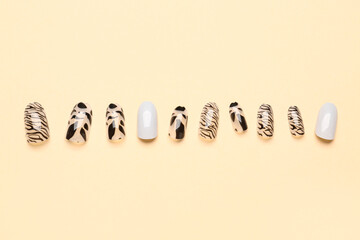 Wall Mural - Press-on nails on beige background