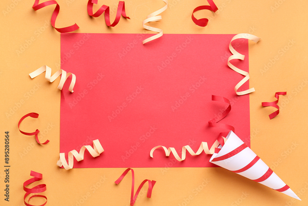 Blank card with party cone and serpentine on orange background