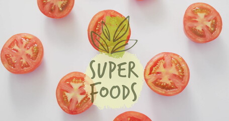 Poster - Super foods text image over sliced tomatoes on white background