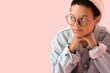 © Pixel-Shot - Stylish little African-American boy in eyeglasses on pink background, closeup