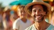 © LifeMedia - A man, donning a sun hat, beams with happiness under the bright sun at a beach, with the background hinting at sunbathing, relaxation, and warm moments.