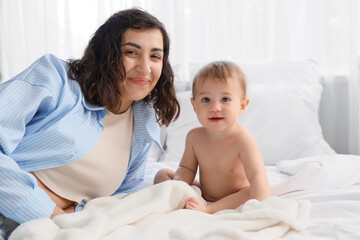 Canvas Print - Mother with her little baby after bathing in bedroom