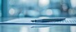 © Gambar Upi - Pen lying on a contract or application form, wide angle view
