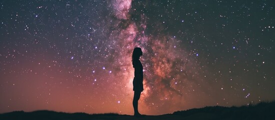 Silhouette of a Woman Standing Before the Milky Way