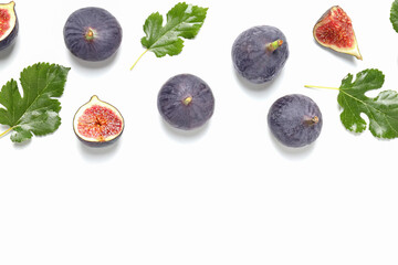 Sticker - Fresh ripe figs with leaves on a white background