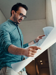Poster - man, design and architecture in office with blueprint, drawing or measurement for building. male per