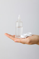 Sticker - Contact lens liquid with lens container in hand